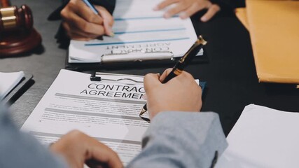 Wall Mural - Business and lawyers discussing contract papers with brass scale on desk in office. Law, legal services, advice, justice and law concept picture with film grain effect