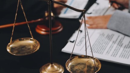 Wall Mural - Business and lawyers discussing contract papers with brass scale on desk in office. Law, legal services, advice, justice and law concept picture with film grain effect