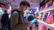 © Chatchanan - Young man shopping for a new tablet in a home electronics store, focusing on screen quality