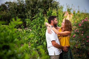 happy couple in exotic green garden