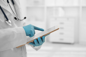 Wall Mural - Doctor with tablet in clinic, closeup view