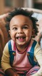 © serperm73 - Portrait of a happy, smiling preschool child in a colorful kindergarten setting, radiating joy and excitement in a playful environment.