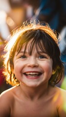 Portrait of a cheerful preschool child, smiling brightly and laughing while looking at the camera in a lively kindergarten setting, full of warmth and joy.