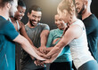 © Haas/peopleimages.com - People, hands and stack at gym for fitness group, support and teamwork motivation for exercise. Friends, class and pile for workout collaboration at health club, solidarity and training community