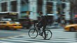 © VK Studio - A businessman on a bicycle skillfully navigates through the lively, bustling city streets with blurred taxi cabs in the background.