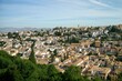© Lidia - View of Granada city from Alhambra, Spain. Traditional white houses on historical arabic Albaicin old town. Montefrio Sacromonte district
