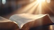 © TENTIP - A beautifully illuminated open book with sun rays highlighting its pages, symbolizing knowledge and inspiration.