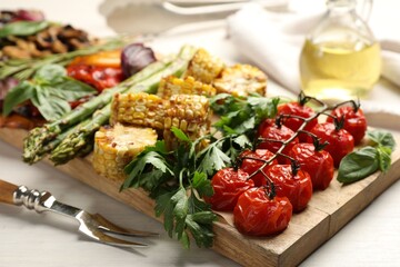 Wall Mural - Delicious grilled vegetables with spices served on white table, closeup