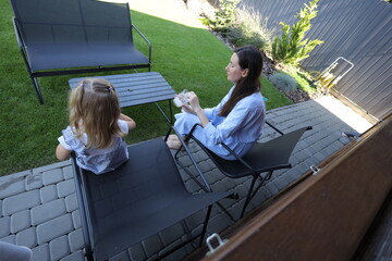 Mother and a child eating ice cream at home