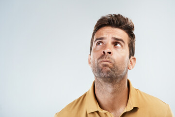 Aufkleber - Confused, man and thinking in studio for solution, problem solving and unsure with space for question or answer. Male person, thoughts and idea on white background with confusion, pensive and choice.