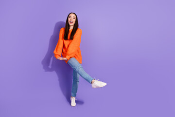 Wall Mural - Photo of crazy funky nice pretty girl wear trendy orange clothes empty space isolated on purple color background