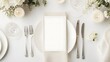 © F - Elegant wedding table setting with a blank place card on a white plate. Perfect mockup for wedding invitations, event branding, or menu design in an upscale, refined atmosphere