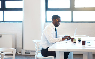 Canvas Print - Black man, serious and laptop as management, employee and accountant in finance company. Male person, tech and working with email, project and portfolio for tax review, development and new business