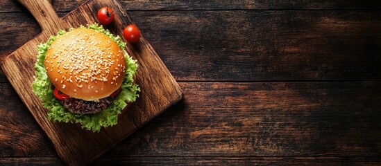 Leinwandbilder - Pork burger on a cutting board. with copy space image. Place for adding text or design