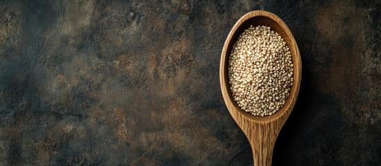 Poster - quinoa on a wooden spoon. with copy space image. Place for adding text or design