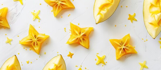 Fototapete - Top view of star fruits on a white background with yellow watercolor. with copy space image. Place for adding text or design