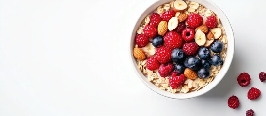 Poster - Overnight oatmeal topped with fresh berries and nuts set against a white background Concept of a healthy breakfast. with copy space image. Place for adding text or design