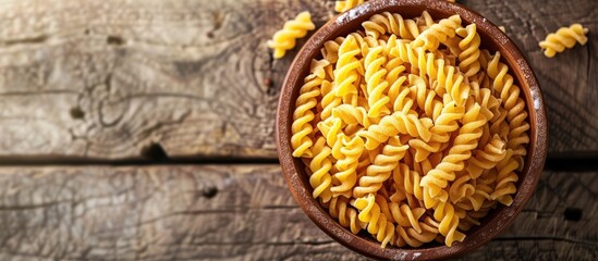 Poster - Fusilli macaroni holder Macaroni arranged on a plate Article discussing pasta Uncooked macaroni Durum macaroni Copy space