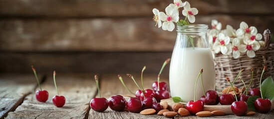Leinwandbilder - Nutritious breakfast featuring cherries almonds and milk on a wooden surface. with copy space image. Place for adding text or design