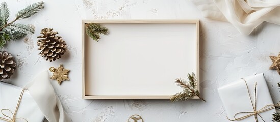 Festive backdrop featuring a blank white photo frame on a beige pastel surface Mockup for a photo or text Top view Flat lay style. with copy space image. Place for adding text or design