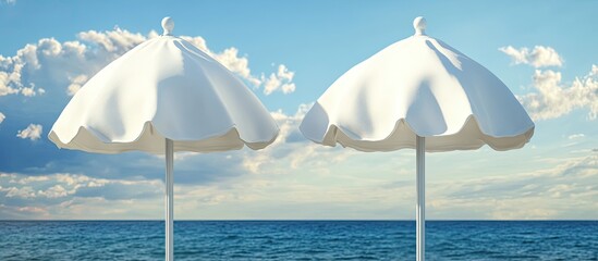 Aufkleber - Close up of two closed white canvas beach umbrellas set against a backdrop of the sea and a blue sky with clouds. with copy space image. Place for adding text or design
