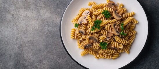 Poster - Gluten free fusilli pasta with forest mushrooms on a white plate Vegetarian vegan dish Italian cuisine Top view flat lay copyspace