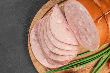 Wall Mural - Tasty meat sausages. Turkey Boiled Ham on a wooden board, top view. copy space