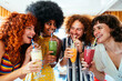 © oneinchpunch - Multiethnic group of friends meeting and drinking milkshakes cocktails at diner restaurant - Multiracial young people bonding and having fun, eating in a fast food burger house