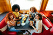 © oneinchpunch - Multiethnic group of friends having meal at 80s vintage diner restaurant - Multiracial young people bonding and having fun, eating in an american fast food burger house