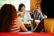 © oneinchpunch - Multiethnic group of friends having meal at 80s vintage diner restaurant - Multiracial young people bonding and having fun, eating in an american fast food burger house