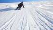 © Ilja - Skier Leaving Trails On Fresh Powder Snow During Sunny Day On Ski Vacation In Mountains