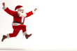 © Hanna - Santa Claus joyfully jumping in a festive pose on a plain background during the holiday season
