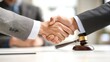 © marco - Lawyers Shaking Hands with Gavel in Background