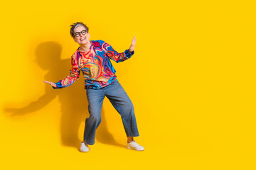 Wall Mural - Full size photo of nice aged woman dancing empty space isolated on yellow color background