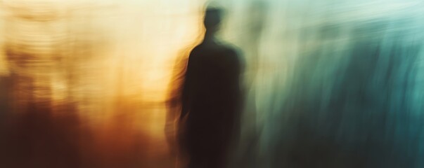 Abstract silhouette of a person with a colorful blurred background, evoking a sense of mystery and emotion.