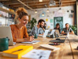 © stefanholm - A collaborative workspace in a modern office, highlighting teamwork and interaction among diverse professionals, set against a minimalist, well-lit environment with sleek furnishings.