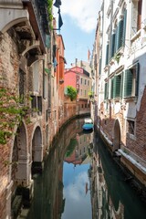 Poster - Narrow canal with a small boat in Venice, Italy, surrounded by historic buildings