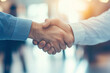 © Sankha - Teamwork and collaboration. Confident handshake seals deal.  Blurred office background.