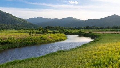 mountain with river clean and green field