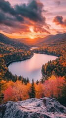 Sticker - Sunset casting warm glow over lake surrounded by autumn trees