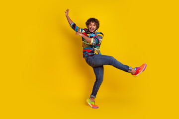 Poster - Full size photo of pretty young guy dancing have fun wear trendy colorful outfit isolated on yellow color background