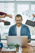 © peopleimages.com - Smile, business and man with multitasking for time management, hands chaos and ignore deadline pressure. Calm, worker and laptop with documents, project schedule and office balance of productivity
