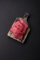 Wall Mural - Juicy fresh raw beef meat with salt, spices and herbs