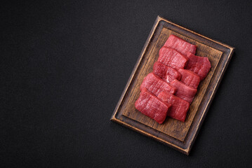 Wall Mural - Juicy fresh raw beef meat with salt, spices and herbs