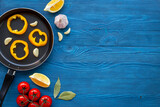 Fototapeta Tulipany - Cooking layout with frying pan and vegetables. Menu and cooking concept