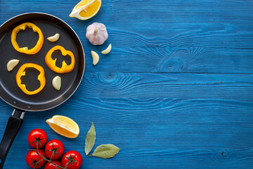 Wall Mural - Cooking layout with frying pan and vegetables. Menu and cooking concept