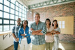 © peopleimages.com - Portrait, business people and leader with arms crossed, startup and creative agency with collaboration. Face, group and employees in modern office, design team and cooperation with pride and smile