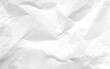 © Noor - White crumpled paper texture background. Clean white paper. Top view.