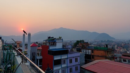 Wall Mural - Beautiful sunset over the cityscape with mountains in the background. Kathmandu, Nepal