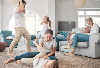 Poster - Parents, children and playing on floor in living room for funny games, joke and support on weekend. Happy, father and mother bonding with kids on carpet at home for humor, love and laughing together